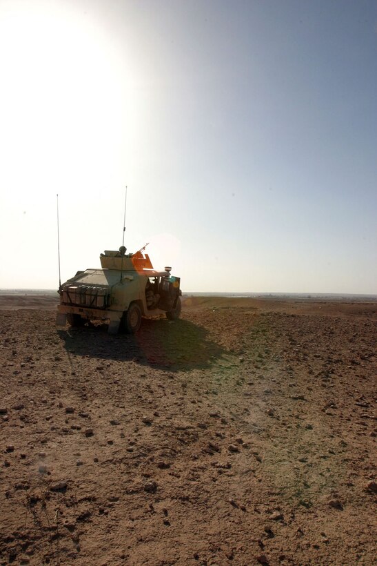 CAMP AL QA'IM, Iraq (Sept. 26, 2005) -- A hummer, a part of the 1st Mobile Assault Platoon, Weapons Company, 3rd Battalion, 6th Marine Regiment, Regimental Combat Team - 2, sits with it's Marines, watching over the desert terrain in the Al Qa'im area of operations.  (Official U.S. Marine Corps photo by Sgt. Jerad W. Alexander)