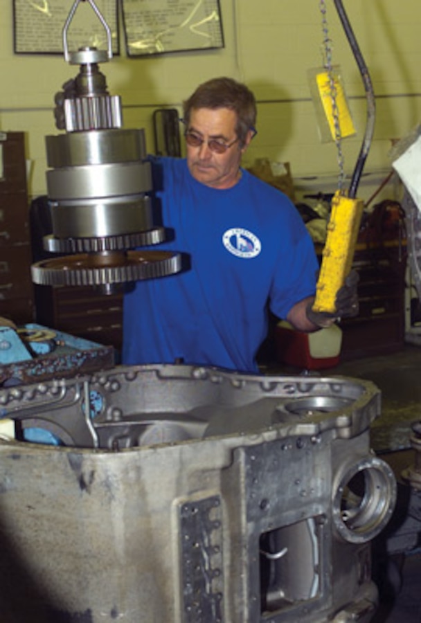 Dick Fork, heavy mobile equipment repairer, removes gears from the speed change housing portion of the AAV's transmission, to inspect for wear and tolerance specifications.