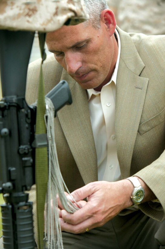 William Bonnie, a retired master sergeant who served as the 1st Marine Division family readiness officer during Operation Iraqi Freedom, reflects on the ultimate sacrifice made by 420 Marines, sailors, soldiers and British soldiers in support of Operation Iraqi Freedom during the 1st Marine Division memorial here May 26.