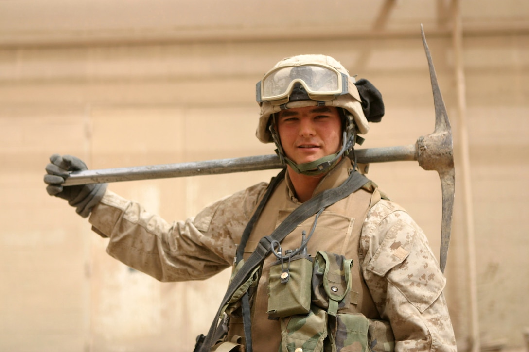 CAMP RIPPER, AL ASAD, Iraq -- Lance Cpl. Rodney Eric Brin, a 20-year-old Keystone Heights, Fla. native and 2nd team leader for 3rd squad, Beowulf, pauses for a look at the door he broke open only moments earlier during a cordon and knock mission, April 15.  The 2002 Keystone Heights High School graduate is a member of Beowulf, the regimental reserve force for Regimental Combat Team 2, responsible for a myriad of tasks from security and sustainment operations to setting up snap vehicle control points.  U.S. Marine Corps photo by Sgt. Stephen D'Alessio (RELEASED)