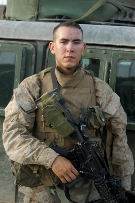 AR RAMADI Iraq (June 27, 2005) - Lance Cpl. Benjamin L. Griffith, a machine gunner and instructor with the Combine Action Platoon, Company B, 1st Battalion, 5th Marine Regiment, is responsible for leading newly trained Iraqi Security Forces on missions in the city here. Griffith, a 21-year-old from Cassoday, Kan., and his ISF counterparts hit the streets daily. The 2002 Flint Hill High School graduate and eight ISF accompany squads with 1st Battalion, 5th Marines. Photo by: Cpl. Tom Sloan