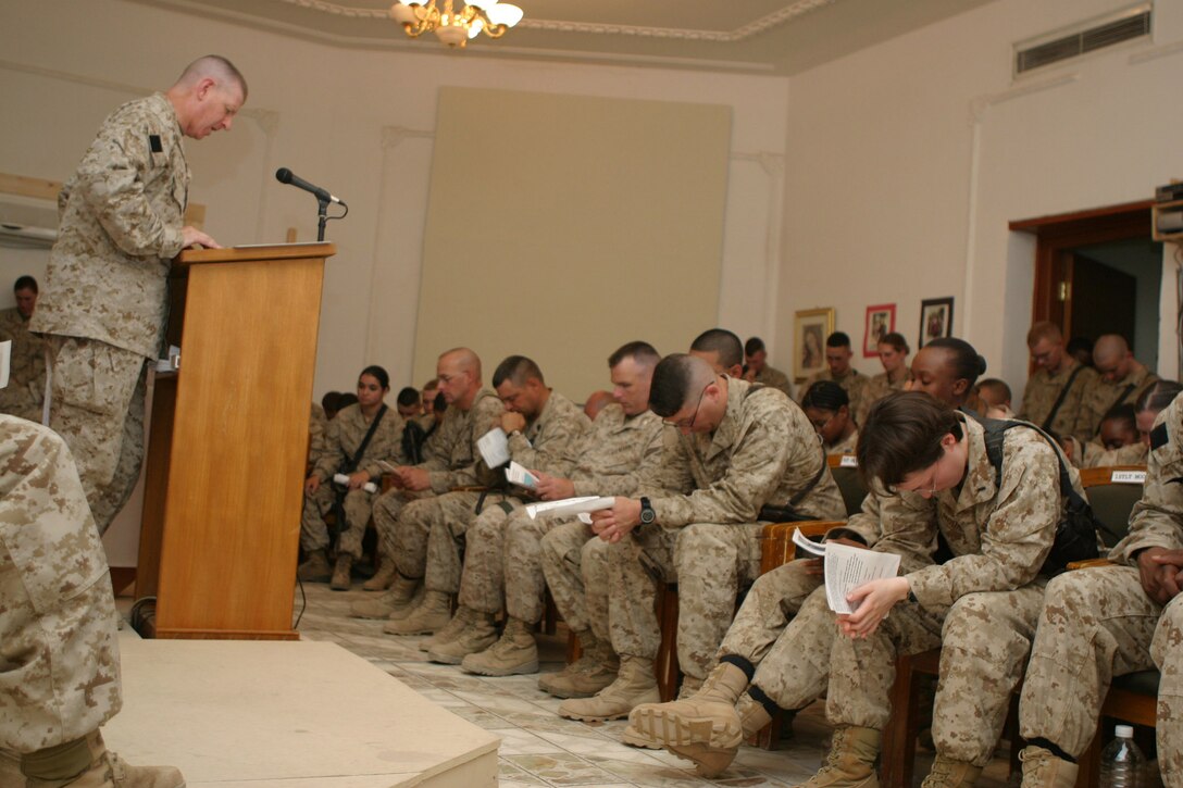 CAMP BLUE DIAMOND, AR RAMADI, Iraq - Marines gather in the camp's chapel during a memorial service, June 27, for Cpl. Holly Charette, a 21-year-old from Cranston, R.I., who deployed here earlier this year with the 2nd Marine Division for Operation Iraqi Freedom.  Charette was killed in a suicide car-bombing when her convoy was struck just a few days earlier.  U.S. Marine Corps photo by Sgt. Stephen D'Alessio (RELEASED)