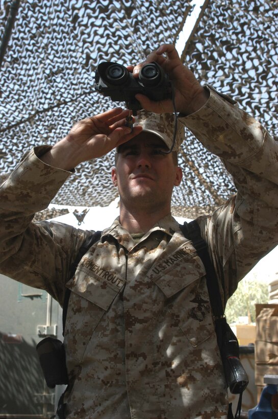 CAMP HURRICANE POINT Ar Ramadi, Iraq (July 20, 2005) - Lance Cpl. Lance Cpl. Darren J. Armentrout, an electronic optical ordinance maintenance technician with Headquarters and Service Company, 1st Battalion, 5th Marine Regiment, repairs a set of night vision goggles at the armory here. The 23-year-old from Broken Arrow, Okla., and six other Marines work at the armory and are responsible for keeping all the Camp Pendleton, Calif., -based infantry battalion's warriors armed with fully operational weapons so they can complete their mission on the urban battlefield. Photo by: Cpl. Tom Sloan