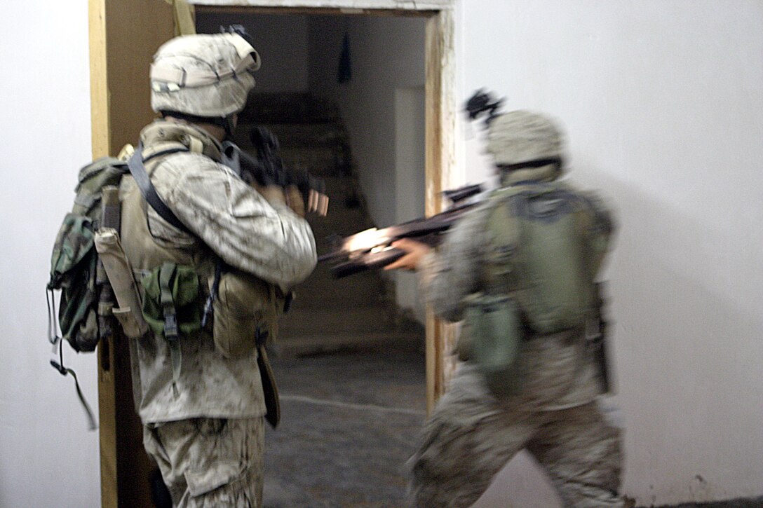 SAQLAWIYAH, Iraq - Marines with 2nd Squad, 4th Platoon, Company A, 1st Battalion, 6th Marine Regiment, search a home here July 27 while during Operation Hard Knock.  Company A Marines searched dozens of houses throughout the small township outside Fallujah, looking for weapons, explosives and insurgent activity while gathering census data on the populace there.  The Marines apprehended one suspected insurgent supporter.