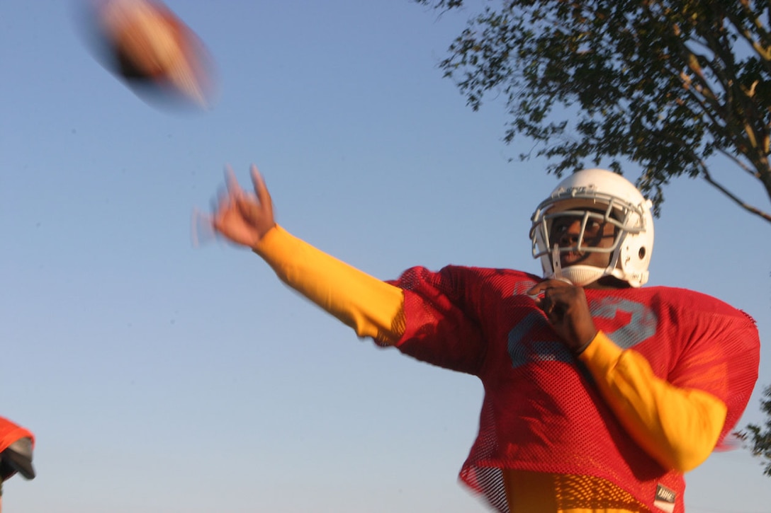 MARINE CORPS BASE CAMP LEJEUNE, N.C. (Oct. 27, 2005)- The Division Intramural Tackle Football team quarterback, Hospital Corpsman 3rd Class Michael "Doc" Robinson, a native of Enterprise, Ala., throws a pass to one of his recievers at practice here today. The division team is confident that they will end the season undefeated, especially after winning their opening game against the 4th Marine Expeditionary Brigade team, 12-6. (Official U.S. Marine Corps photo by Lance Cpl. Lucian Friel (RELEASED)
