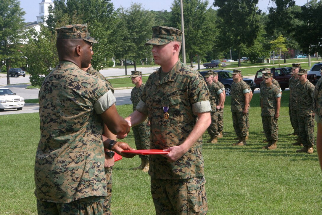 MARINE CORPS BASE CAMP LEJEUNE, N.C. (June 27, 2005) – Sergeant Jason M. Simms of Philadelphia, Pa., was awarded the Purple Heart medal here, July 25, for wounds received while deployed in support of Operation Iraqi Freedom with 2nd Light Armored Reconnaissance Battalion, 2nd Marine Division.