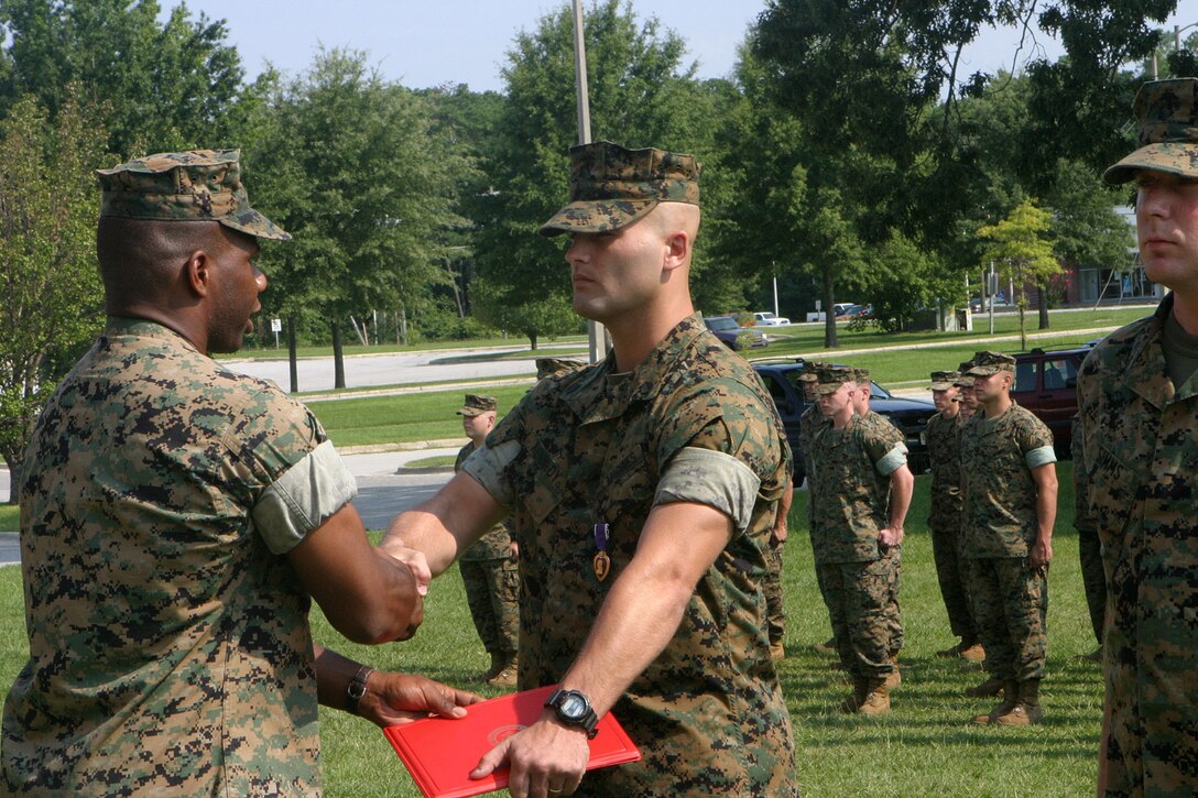 MARINE CORPS BASE CAMP LEJEUNE, N.C. (June 27, 2005) – Staff Sgt. John M. Kennedy of Junction City, Ohio, was awarded the Purple Heart medal here, July 25, for wounds received while deployed in support of Operation Iraqi Freedom with 2nd Light Armored Reconnaissance Battalion, 2nd Marine Division.