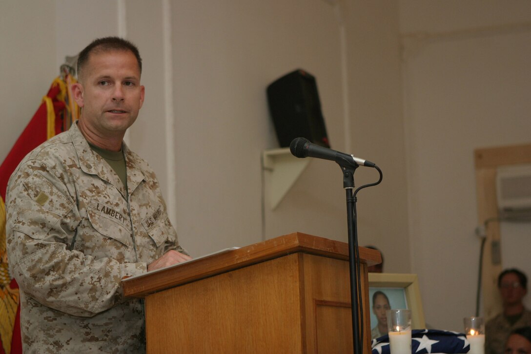 CAMP BLUE DIAMOND, AR RAMADI, Iraq -- Major Craig P. Lambert, deputy communications officer, speaks to gatherers in the camp's chapel during a memorial service for Cpl. Ramona M. Valdez a 21-year-old field radio operator and member of the 2nd Marine Division's G-6 Communications section.  Valdez was killed in when a suicide car-bomber struck her convoy a few days earlier.  U.S. Marine Corps photo by Sgt. Stephen D'Alessio (RELEASED)