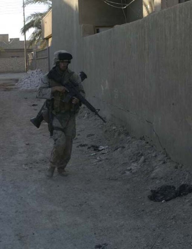 HIT, Iraq- (June 28, 2005) A Marine with 3rd Battalion, 25th Marine Regiment, Company L patrols during a sweep of the city of Hit during Operation Sword.  The operation was conducted to destroy insurgency leadership strong points.  The Marines of 2nd Marine Division conducted counter-insurgency operations with Iraqi Security Forces to isolate and neutralize anti-coalition forces.  U.S. Marine Corps photo Cpl. Eric C. Ely (RELEASED)