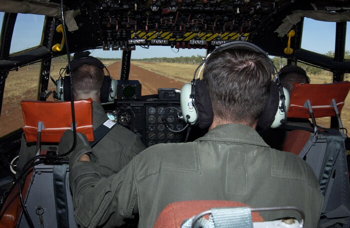 The C-130 flight crew from Marine Aerial Refueler Transport Squadron 152 readies the giant aircraft before touching down on the assault landing zone here, July 28.