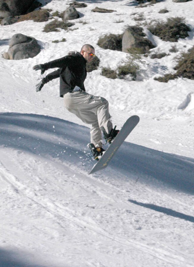 Pfc. Jonathan Jens, India Company 3rd Battalion 7th Marines automatic rifleman, looks for a mock sniper after a Marine was shot and injured during an assault training exercise as a part of the Weapons and Tactics Instructor course at the Trinity Christian Center, Yuma, Ariz., April 15.