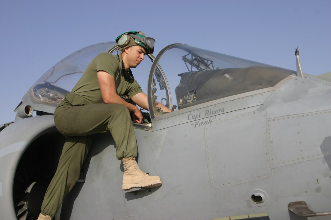 AL ASAD, Iraq ? Sergeant Douglas Acero an avionics technician with Marine Attack Squadron 311 checks some of the avionics systems in a ?Tomcat? AV-8B Harrier April 29. Acero, along with his fellow ?Tomcats? are scheduled to return to Marine Corps Air Station Yuma, Ariz., in May after a seven-month deployment in support of Operation Iraqi Freedom.