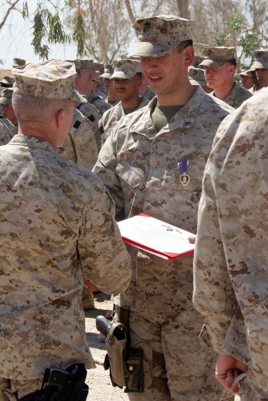 CAMP FALLUJAH, Iraq -- Major General Richard A. Huck, 2nd Marine Division Commanding General visited 3rd Battalion, 8th Marine Regiment  presented Lance Cpl. Andrew Hulkow with his Purple Heart.  Huck also spoke to the Marines about the job they have been doing so far.  Official U.S. Marine Corps photo by Lance Cpl. Athanasios L. Genos