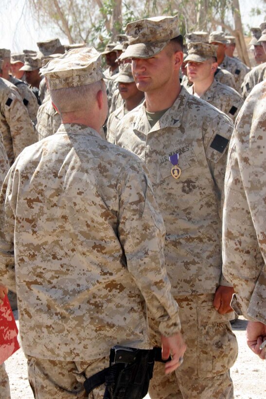 CAMP FALLUJAH, Iraq -- Major General Richard A. Huck, 2nd Marine Division Commanding General visited 3rd Battalion, 8th Marine Regiment  presented Lance Cpl. Nicholas Siewert with his Purple Heart.  Huck also spoke to the Marines about the job they have been doing so far.  Official U.S. Marine Corps photo by Lance Cpl. Athanasios L. Genos