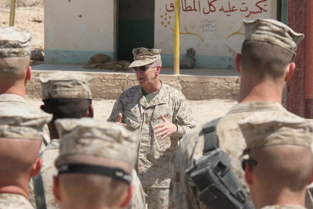 CAMP FALLUJAH, Iraq -- Major General Richard A. Huck, 2nd Marine Division Commanding General visited 3rd Battalion, 8th Marine Regiment to present them with their Purple Hearts.  Huck also spoke to them about the job they have been doing so far.  Official U.S. Marine Corps photo by Lance Cpl. Athanasios L. Genos