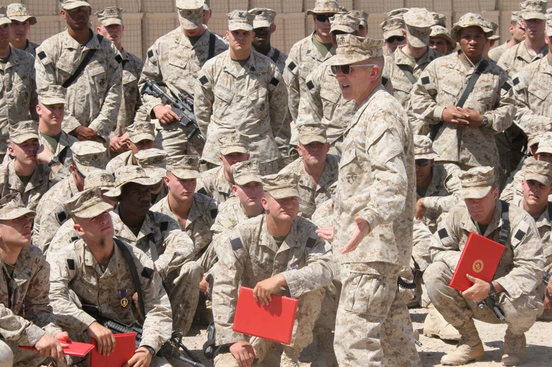 CAMP FALLUJAH, Iraq -- Major General Richard A. Huck, 2nd Marine Division Commanding General visited 3rd Battalion, 8th Marine Regiment to present them with their Purple Hearts.  Huck also spoke to them about the job they have been doing so far.  Official U.S. Marine Corps photo by Lance Cpl. Athanasios L. Genos