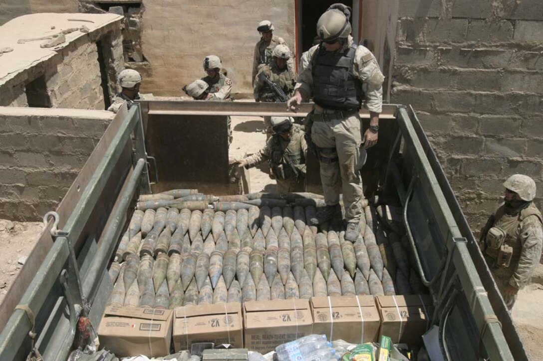 HIT, Iraq-(June 29, 2005) Soldiers with the 2nd Brigade Combat Team prepare to dispose of ordnance found in a building used by insurgents.  The Soldiers searched Hit during Operation Guardian Sword while Marines of the 2nd Marine Division conducted counter-insurgency operations with Iraqi Security Forces in other areas of the city.  U.S. Marine Corps photo by Lance Cpl. Kevin N. McCall (RELEASED)