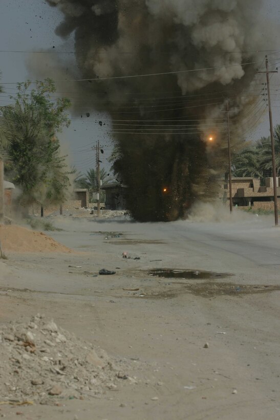HADITHA, Iraq ? A massive explosion disposes of an improved explosive device found on a street here by Marines of 3rd Battalion, 1st Marine Regiment Oct. 13. The four-man Explosive Ordnance Disposal team attached to the battalion was responsible for disposing of this roadside bomb and more than 30 others since attaching with the battalion.