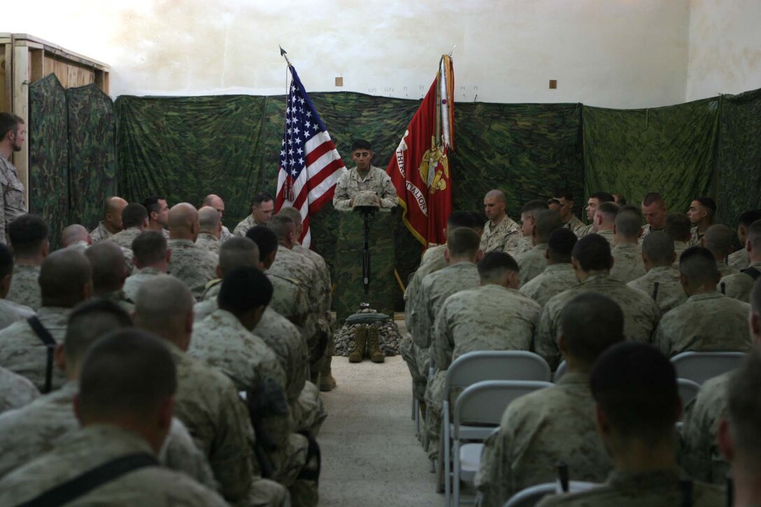 HADITHA, Iraq (Nov. 29, 2005)  - Marines with 3rd Battalion, 1st Marine Regiment reflect on the life of a lost brother during Lance Cpl. Miguel Terrazas' memorial service here Nov. 29. The El Paso, Texas native served bravely as a rifleman with the battalion's Kilo Company for many months before an improvised explosive device struck his vehicle and took his life. (Official Marine Corps photo by Cpl. Adam C. Schnell)