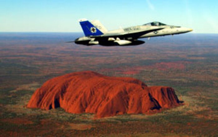 Capt. Michael P. Major, Marine Fighter Attack Squadron 212 embark officer, passes over Ayers Rock, Uluru, Australia?s most famous natural landmark, during a long-range power projection strike exercise, July 29.