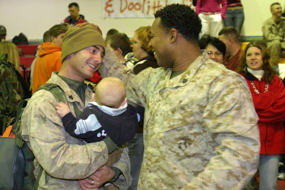 MARINE CORPS BASE CAMP LEJEUNE, N.C. - Marines with 1st Battalion, 8th Marine Regiment celebrated their return with family and friends at a homecoming ceremony Jan. 28. The battalion spent seven months in Iraq and arrived in three waves to their waiting family members who cheered them as they made their way off the buses.
