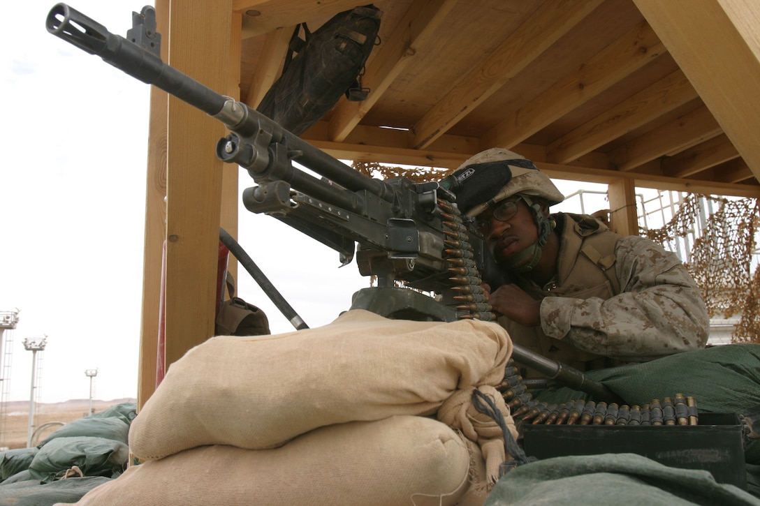 CAMP AL QA'IM, Iraq (April 6, 2005)- Lance Cpl. Jeffery Quattlebaum, a team leader with 2nd Platoon, K Company, 3rd Battalion, 2nd Marine Regiment, Regimental Combat Team 2 sights in during his over watch post here April 6. The Philadelphia native has a tremendous responsibility of guarding Camp Al Qa'im and maintaining security of their forward operating base. Official U.S. Marine Corps photo by Lance Cpl. Lucian Friel (RELEASED)
