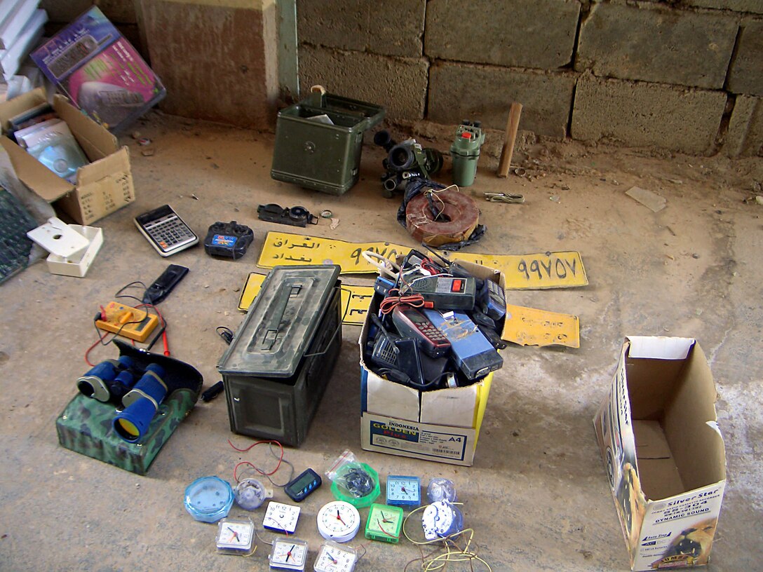 Hit, Iraq (August 30, 2005)-- Marines from Company "I", 3rd Battalion, 25th Marines uncovered boxes of ammunition, explosives, electronic equipment and propaganda during a cache find underneath a hotel on a patrol. (Official USMC Photo courtesy of 3rd Battalion, 25th Marine Regiment)