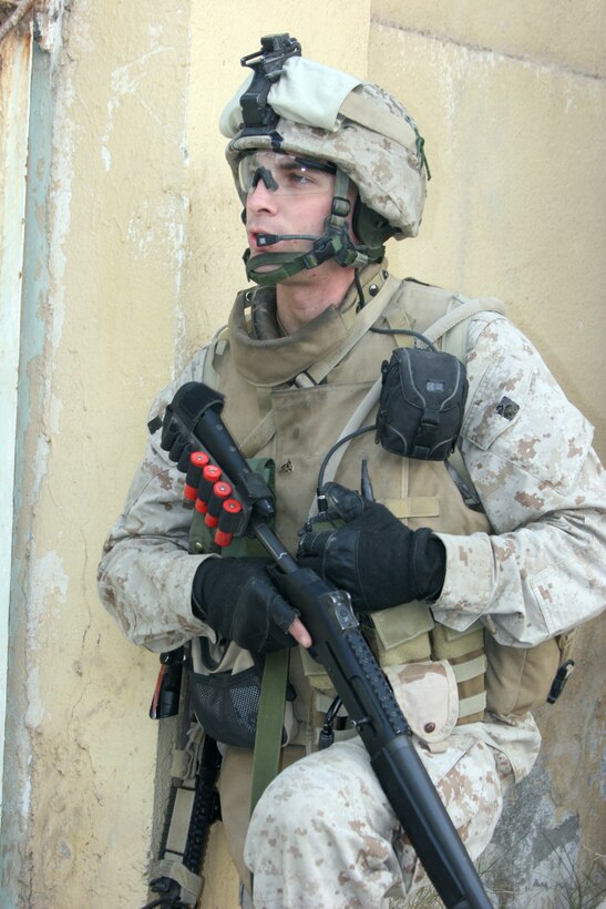 AR RAMADI, Iraq ? A Marine with Combined Anti-Armor Team White, 3rd Battalion, 7th Marine Regiment, speaks on his personal radio during Operation Block Party 6 Nov. 30.