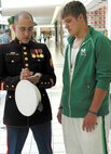 Sgt. Richard A. Davenport speaks to a newly graduated student while canvassing at a mall in Fort Wayne, Ind. The recruiting mission has become more difficult over the past few months because of sustained operations overseas. Because of this, recruiters are educating themselves and training harder to address concerns of applicants and parents. (Official Marine Corps photo by Sgt. Jason D. Gallentine)
