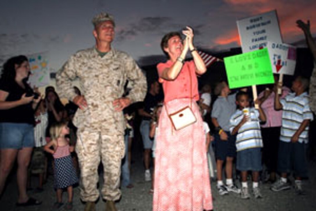 Commandant of the Marine Corps Gen. Michael W. Hagee and his wife, Silke, welcome home Marines and Sailors from 3rd Battalion, 4th Marine Regiment on Sunday.  Many Marines were surprised to see the commandant greet them as they stepped of the bus on July 31.