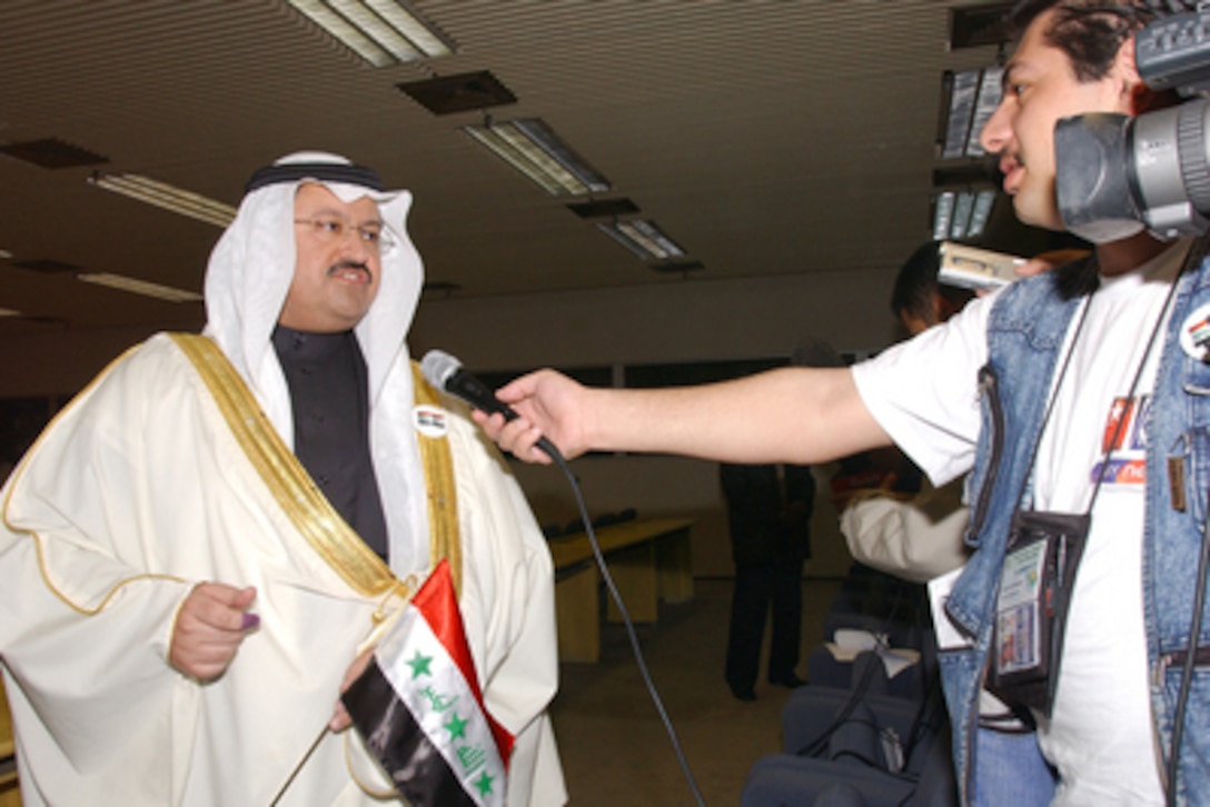 Iraqi President Ghazi al-Yawar speaks with reporters after casting the first ballot in Iraq's first free election at a polling station in the Baghdad Convention Center in Baghdad, Iraq, on Jan. 30, 2005. Millions of Iraqis throughout the country are participating in Iraq's first free election in over 50 years. 