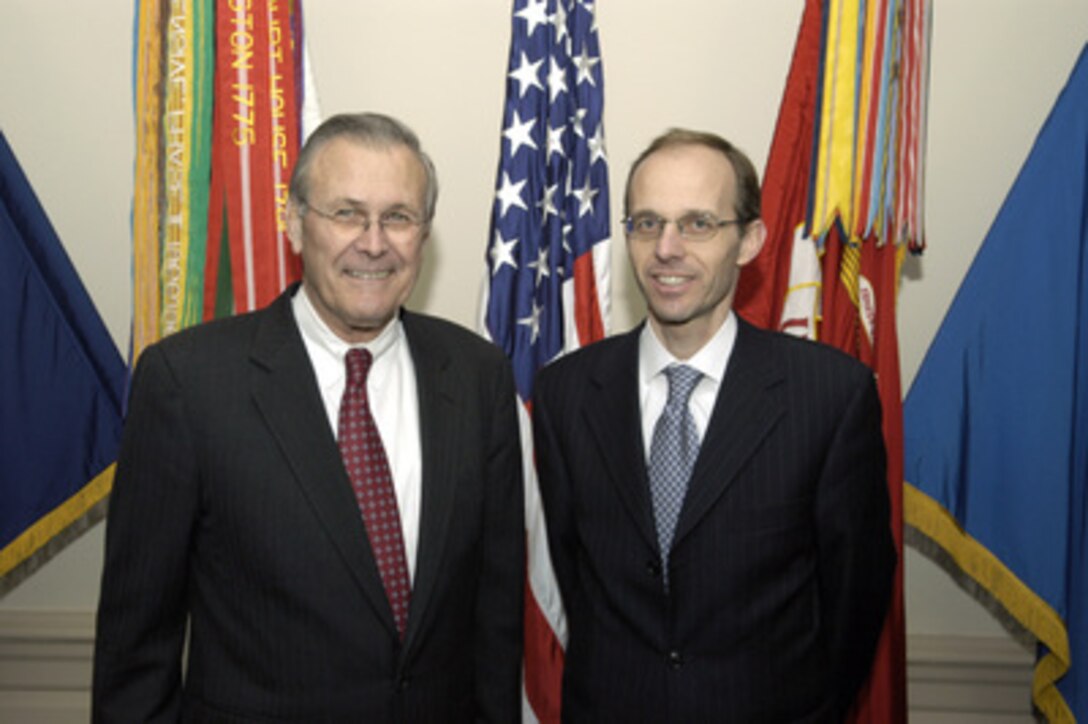 Secretary of Defense Donald H. Rumsfeld (left) and Luxembourg's Minister of Defense Luc Frieden pose for photographs in the Pentagon on Jan. 31, 2005. The two leaders are meeting to discuss defense issues of mutual interest. 