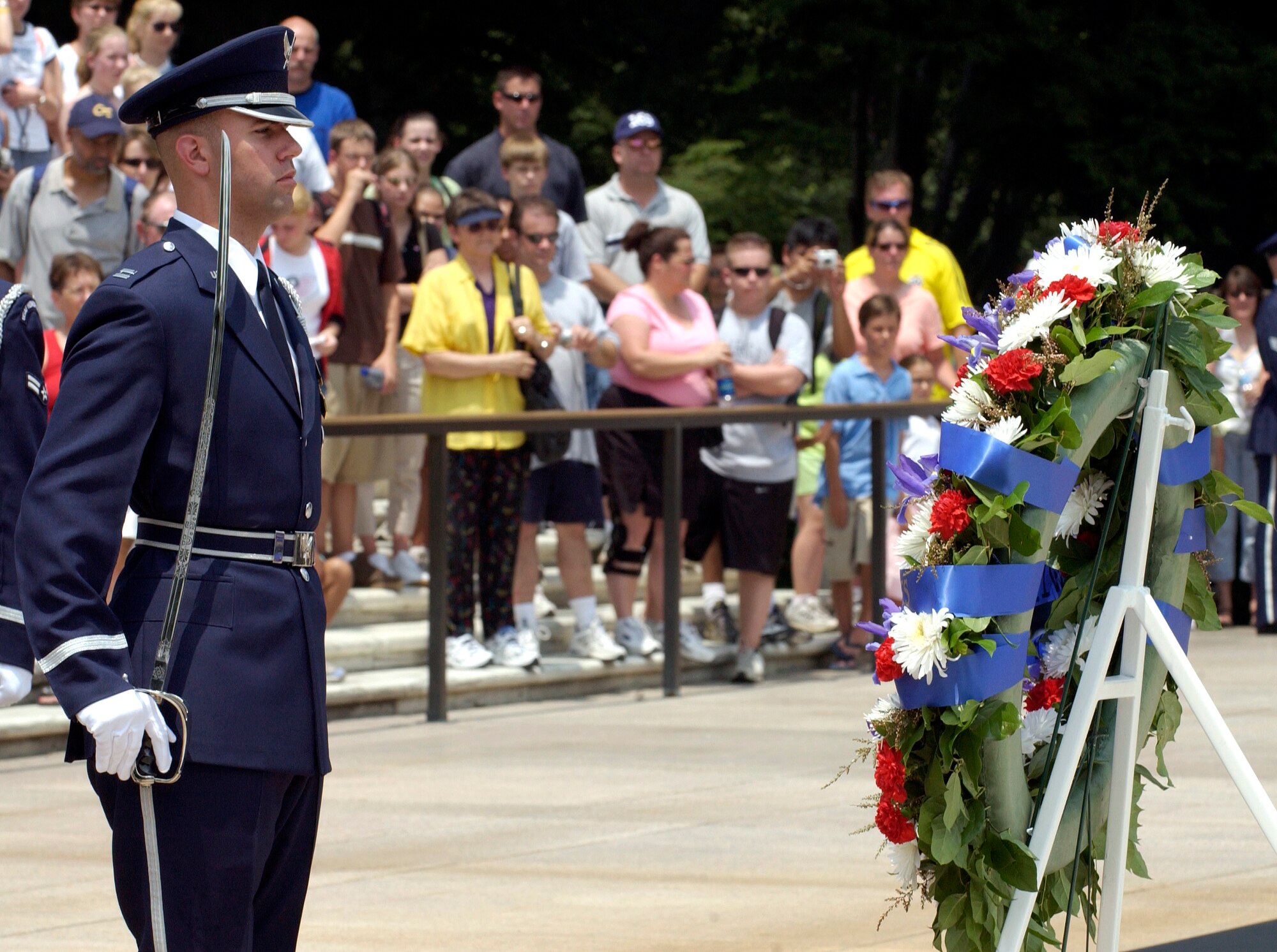 WASHINGTON -- A member of the U.S. Air Force Honor Guard renders honors at Arlington National Cemetery's Tomb of the Unknowns June 30 during a ceremony commemorating airpower and the 60th anniversary of World War II.  Air Force Chief of Staff Gen. John P. Jumper officiated at the event.  (U.S. Air Force photo by Master Sgt. Jim Varhegyi)