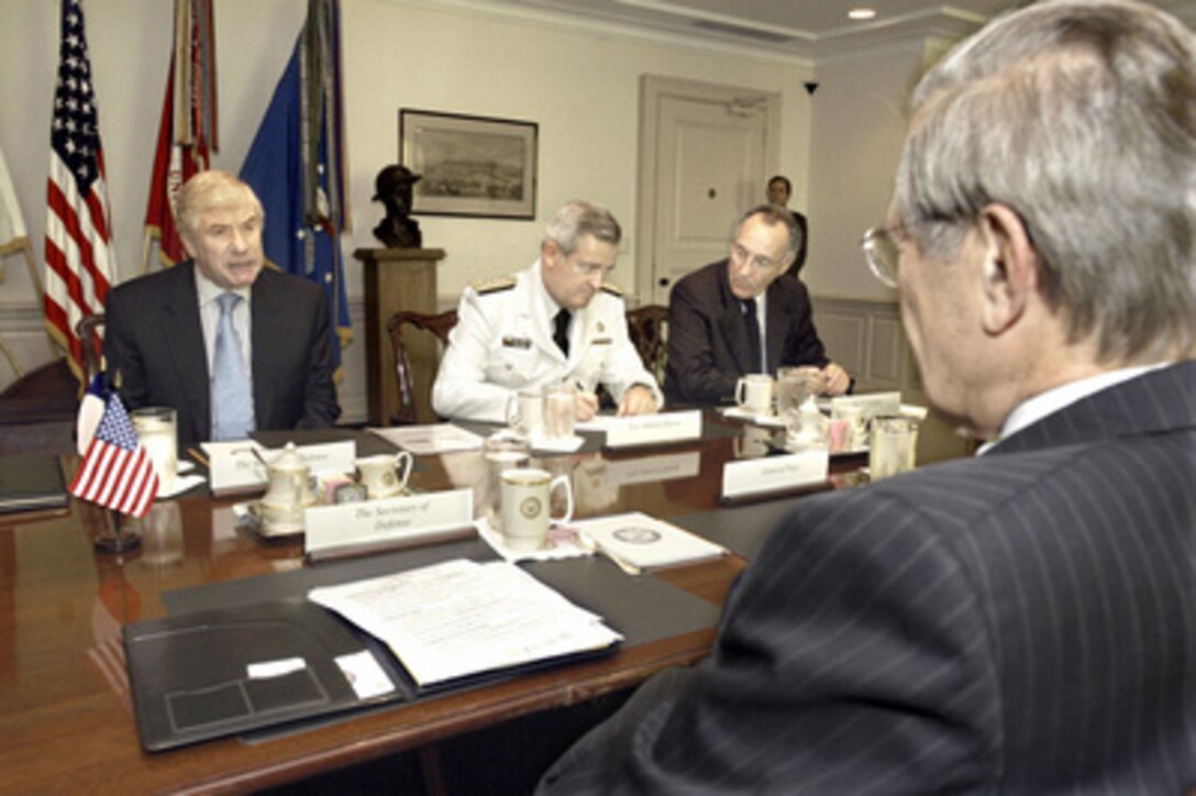 Chilean Minister of Defense Jaime Ravinet (left) meets with Secretary of Defense Donald H. Rumsfeld (foreground) in the Pentagon on June 30, 2005, to discuss a broad range of bilateral security issues. Joining Ravinet for the talks are Chief of National Defense Vice Adm. Jorge Huerta Dunsmore (center) and International Advisor to the Minister of Defense Renan Fuentealba (right). 