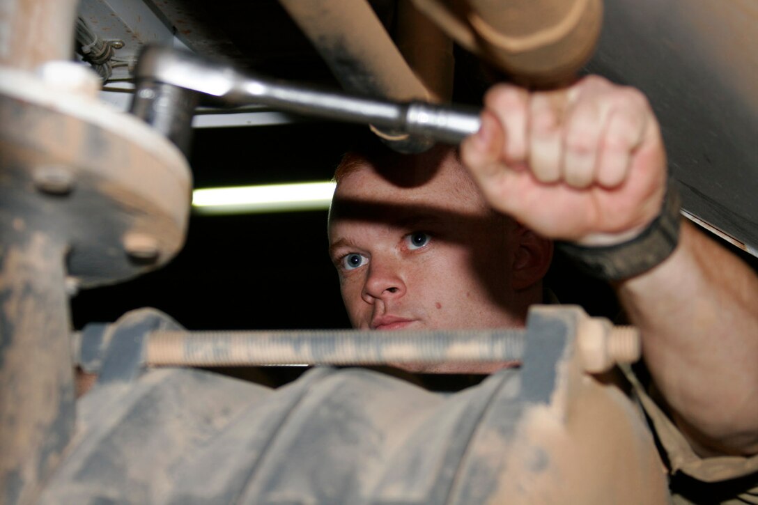 AL ASAD, Iraq ? Sgt. Scott Homer, ground support equipment mechanic and electrician from Aberdeen, Md., puts the final touches on the blower in a mobile air conditioner July 1.  The mobile air conditioner is used to cool the inside of aircraft, primarily KC-130Js, so that technicians can work on the avionics components.