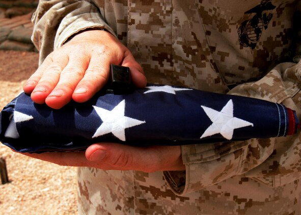 AL ASAD, Iraq-Standing for liberty, pride and freedom, the United States flag is a symbol for independence.  Marines of the forward deployed 2nd Marine Aircraft Wing are proud of the Stars and Stripes.  Each day someone?s personal flag is flown here for reasons special to each individual.  Some are flown in aircraft and some wave on the flagpole.  Since March this unit, serving in the Al Anbar province, has flown more than 165 personal flags and have more than 70 waiting to be raised (at the time this story posted).