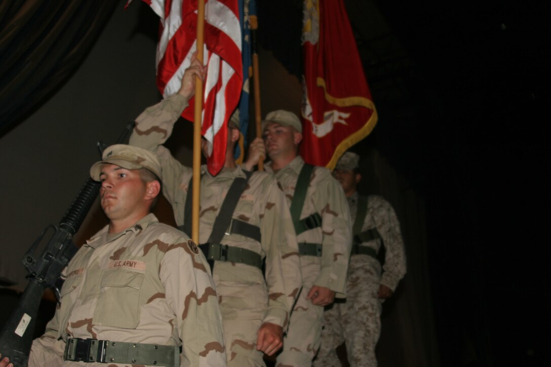 AL ASAD, Iraq ? Members of the Al Asad joint service color guard retire the colors during the Independence Day observance here, July 4.