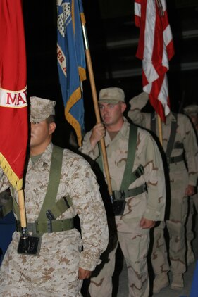 AL ASAD, Iraq ? Members of the Al Asad joint service color guard post the colors during the Independence Day observance here, July 4.