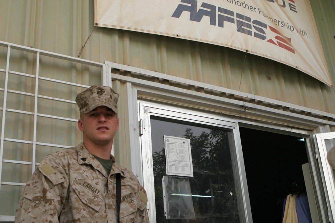 Sgt. Keith M. Laquay, retail operations chief, Service Company, Headquarters and Service Battalion, 2nd Force Service Support Group (FWD), explains how the Camp Fallujah Exchange inventory supply operates July 4, 2005. Laquay lost his personal belongings and store inventory when his Mahmudiyah exchange went up in flames.