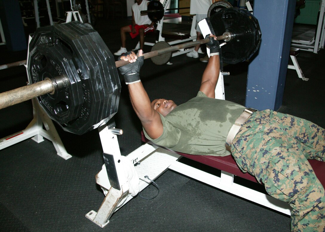 Staff Sgt. Lenwood L. Hall, 6th Marine Corps District comptroller chief, benches over 300 pounds at the Parris Island War Memorial gym Tuesday. Hall has a personal best bench weight of 365 pounds.