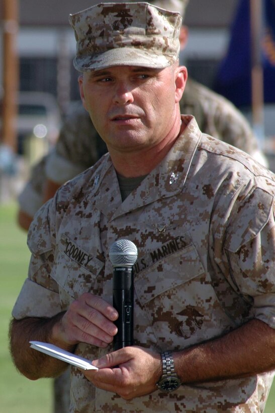 Col. James J. Cooney, station outgoing commanding officer, makes his remarks during the station's change of command ceremony at the parade field July 7. Cooney assumed role of the station CO in July of 2002 and is now assigned to Headquarters, U.S. Marine Corps, Washington, D.C.