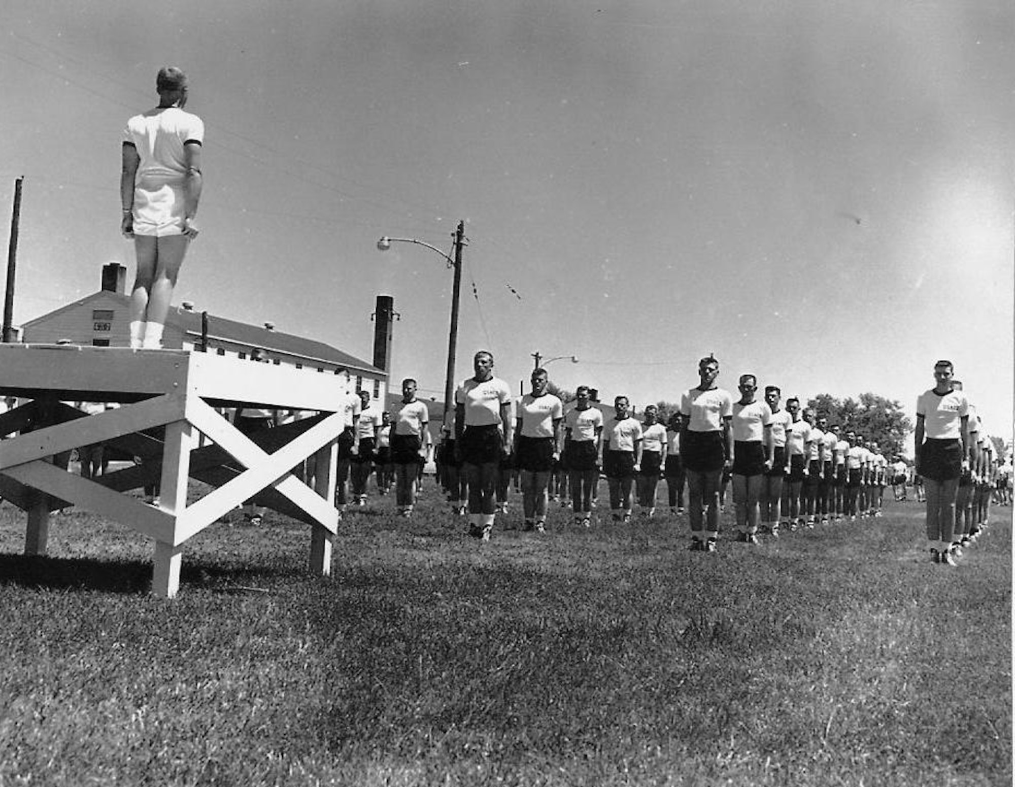 LOWRY AIR FORCE BASE, Colo. -- Basic cadets from the first Air Force Academy class line up for physical training here, the temporary location for the academy while permanent facilities were being constructed in Colorado Springs.  (U.S. Air Force photo)