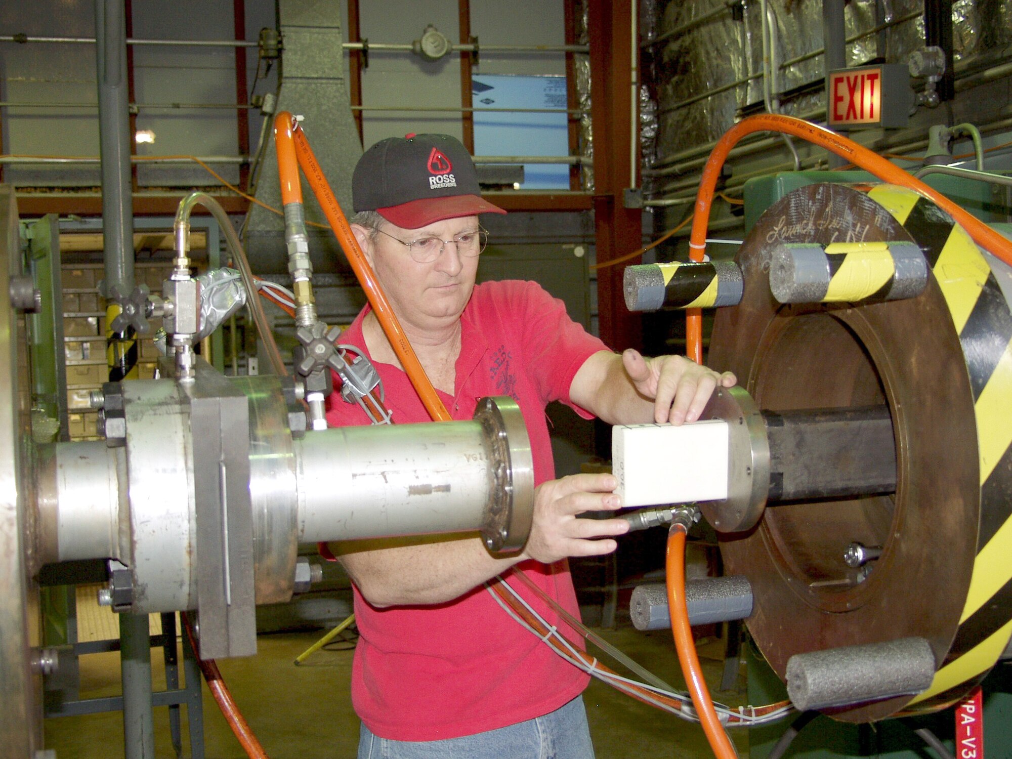 ARNOLD AIR FORCE BASE, Tenn. -- Machinist Larry Phipps loads a foam projectile into an 86-foot-long rectangular barrel used to conduct impact testing for the space shuttle return-to-flight program at the Arnold Engineering Development Center here.  (U.S. Air Force photo)