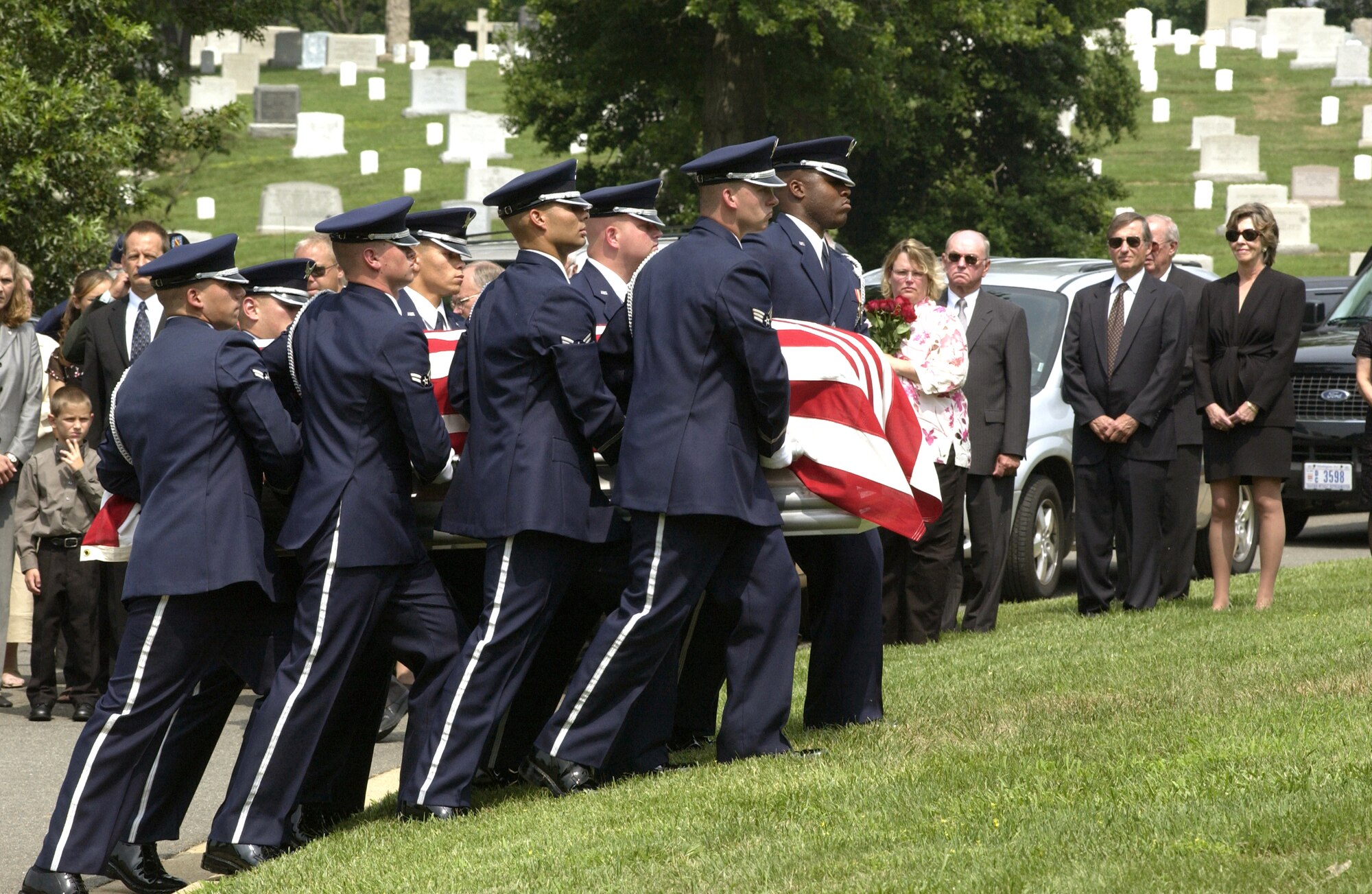 ARLINGTON, Va. -- Air Force Honor Guard pallbearers carry the coffin of retired Gen. Bernard Adolph Schriever to his burial site July 12 at Arlington National Cemetery.  (U.S. Air Force photo by Airman Rusti Caraker)                   