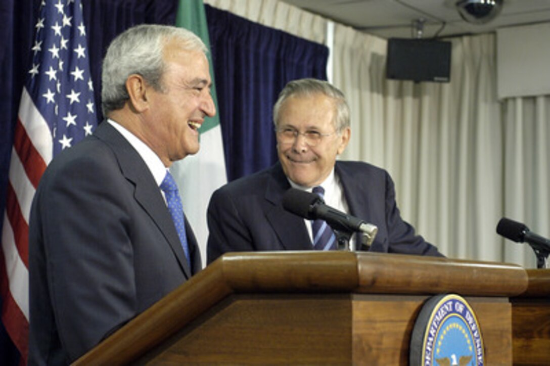 Secretary of Defense Donald H. Rumsfeld (right) and Italian Minister of Defense Antonio Martino (left) share a light moment during joint Pentagon press conference on July 12, 2005. Rumsfeld and Martino met earlier to discuss a variety of security issues of mutual interest. 