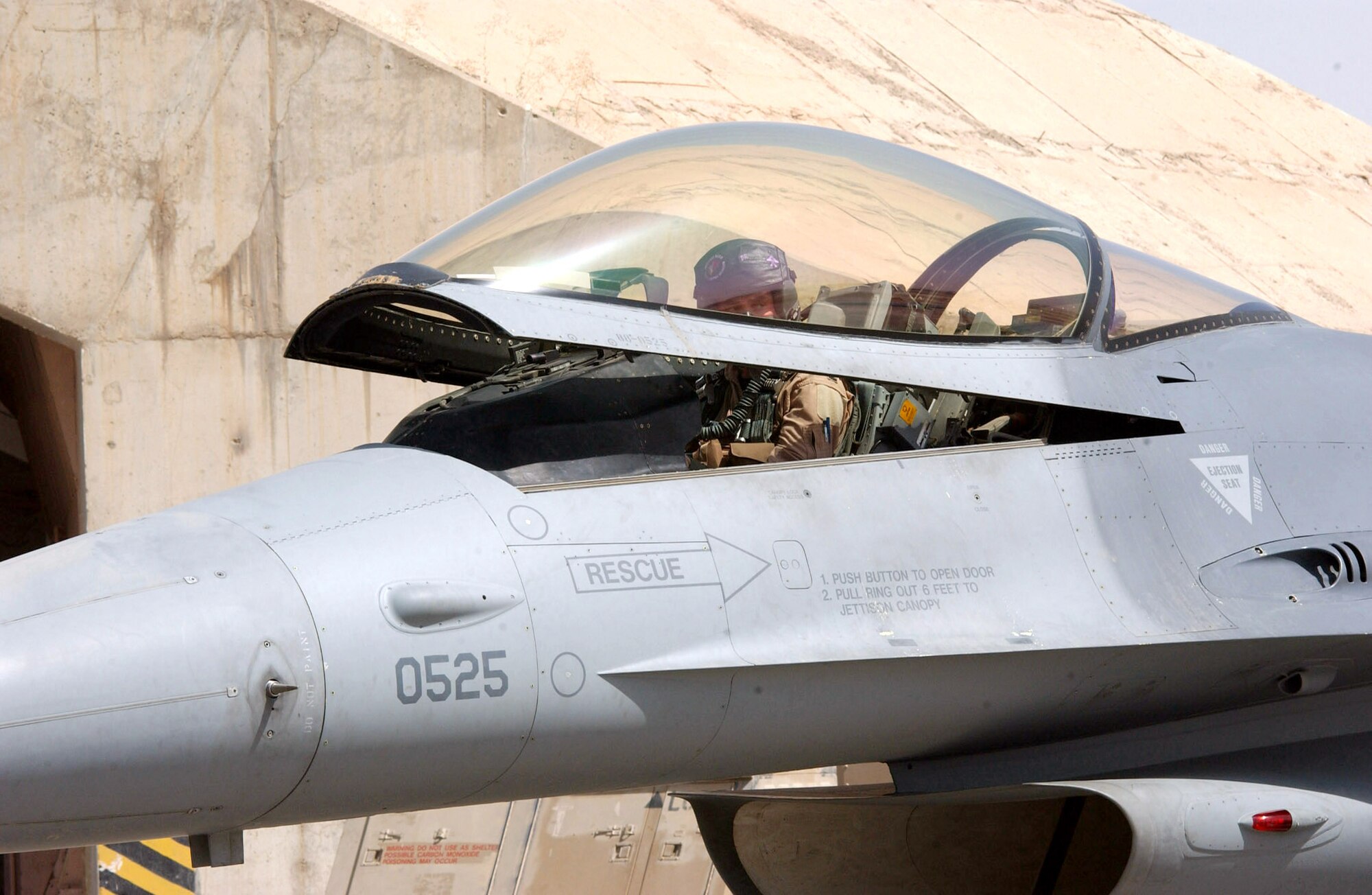 BALAD AIR BASE, Iraq -- Following his preflight checks, 1st Lt. Christopher Jones closes the canopy to his aircraft before a mission supporting Operation Iraqi Freedom.  He is an F-16 Fighting Falcon pilot with the 510th Expeditionary Fighter Squadron.  (U.S. Air Force photo by Senior Airman Shaun Emery)                               