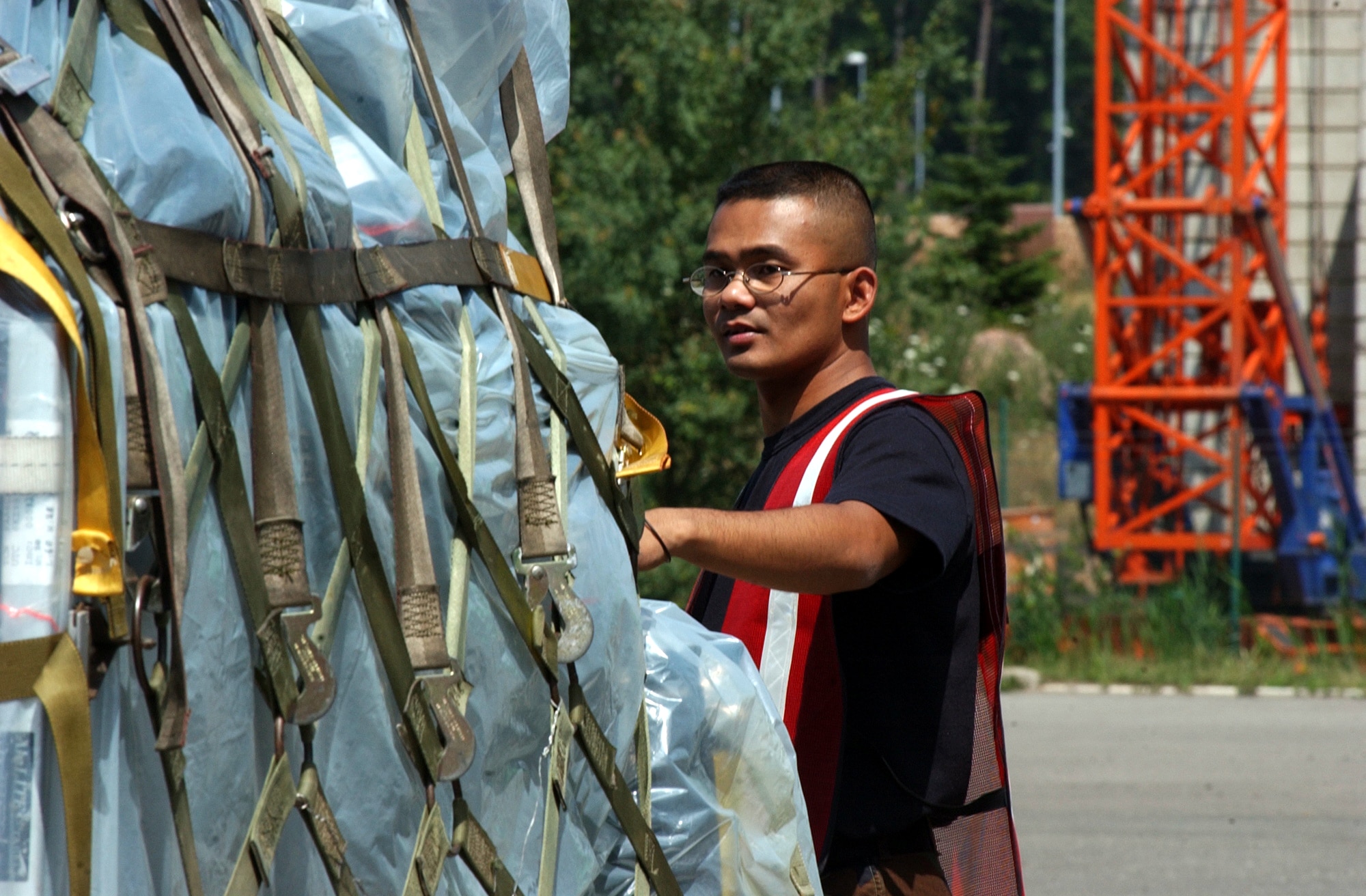 RAMSTEIN AIR BASE, Germany -- Staff Sgt. Ronnel Villodres checks a pallet of cargo July 15 before it is loaded onto a C-130 Hercules as part of a monthlong airlift mission to the Darfur region of Sudan.  Three C-130 aircraft and about 40 Airmen here left July 16 for Kigali, Rwanda, as part of NATO's response to support the African Union's expanded peacekeeping mission in Darfur with logistics and training.  Sergeant Villodres is assigned to the 435th Logistics Readiness Squadron.  (U.S. Air Force photo by Master Sgt. David D. Underwood Jr.)