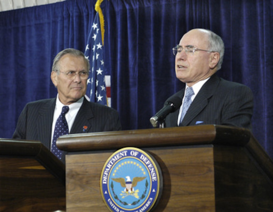 Prime Minister John Howard (right) of Australia responds to a reporter's question during a joint Pentagon press conference with Secretary of Defense Donald H. Rumsfeld (left) on July 18, 2005. Rumsfeld met with Howard and his delegation to discuss various bilateral security issues including the global war on terrorism. 