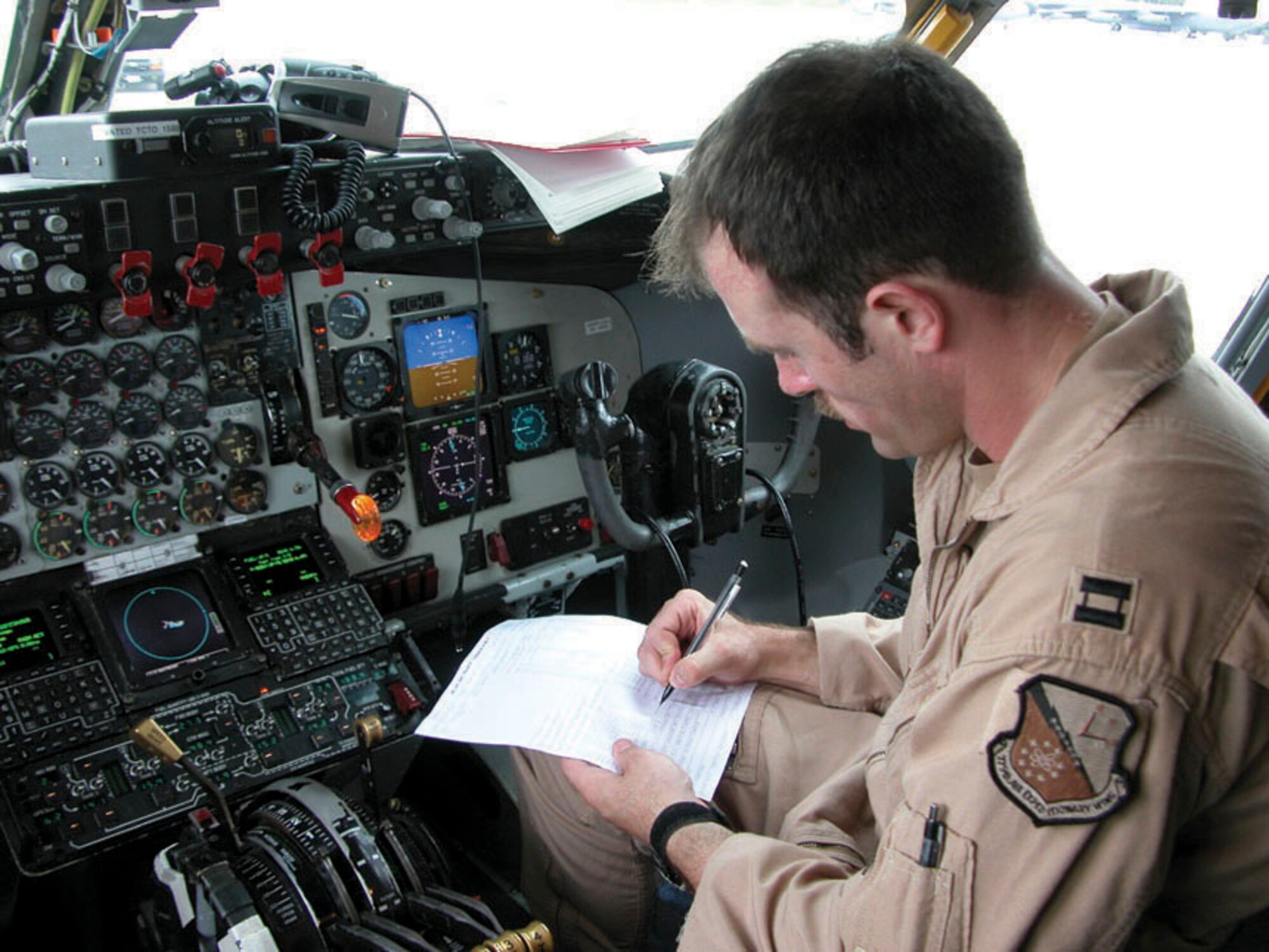 SOUTHWEST ASIA -- Capt. Brandon Fleck prepares for a refueling mission in a KC-135 Stratotanker's flight deck.  He is a pilot with the 340th Expeditionary Air Refueling Squadron at a forward-deployed location.  (U.S. Air Force photo by Tech. Sgt. Mark Munsey)