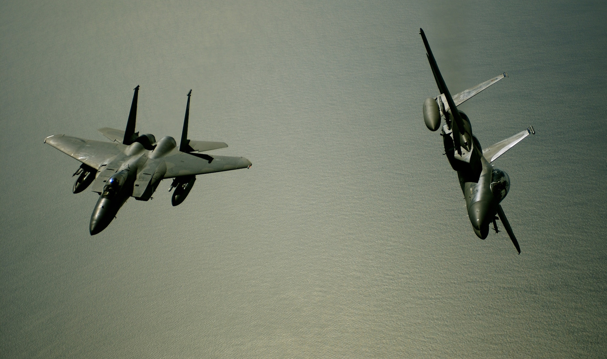 OVER THE ATLANTIC OCEAN -- Two F-15 Eagles from  Langley Air Force Base, Va., fly in formation.  (U.S. Air Force photo by Tech. Sgt. Ben Bloker) 